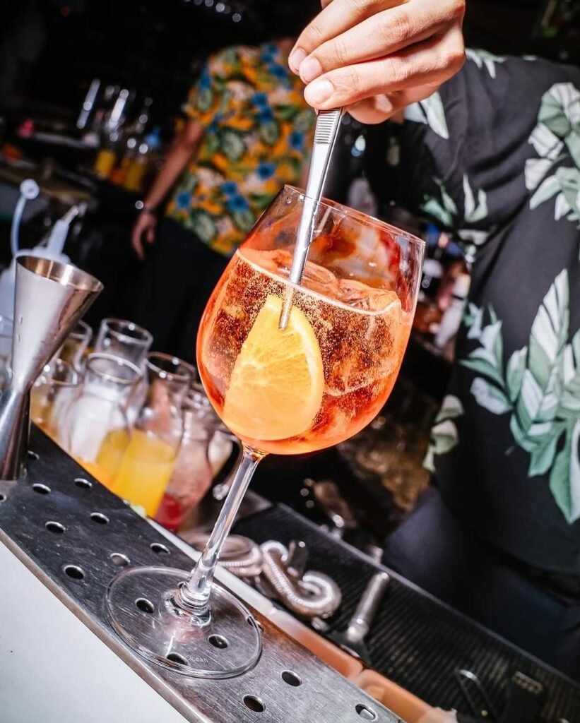 A cocktail with lemon being prepared in Lily Fu's